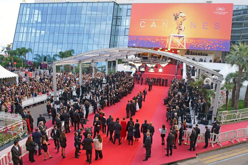 TRAJPR ACTORS POSING FOR PHOTOGRAPHERS ON THE RED CARPET BEFORE GOING UP THE FAMOUS 24 STEPS (aerial view from a 6-meter mast). Cannes Film Festival, France.