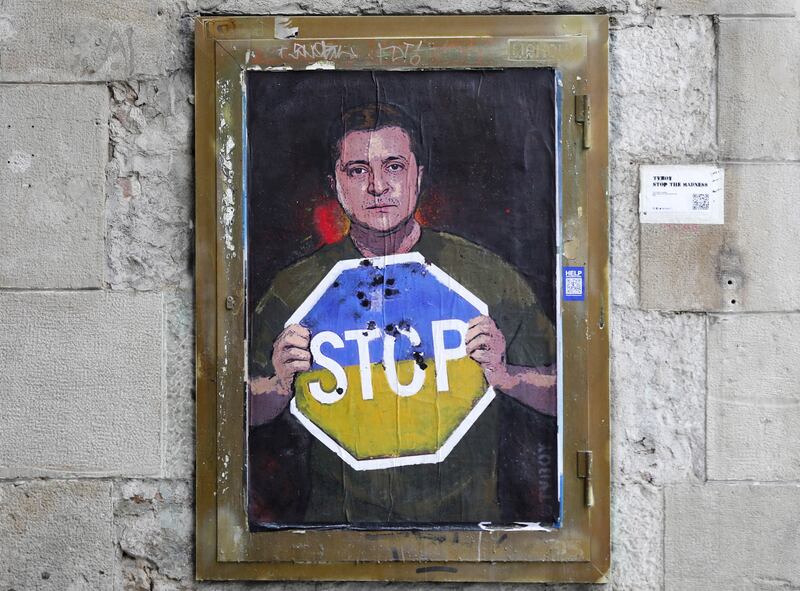 Graffiti depicting Ukrainian President Volodymyr Zelenskyy holding a bullet-ridden 'Stop' sign by urban artist Tvboy appeared on a street in downtown Barcelona, Spain. EPA