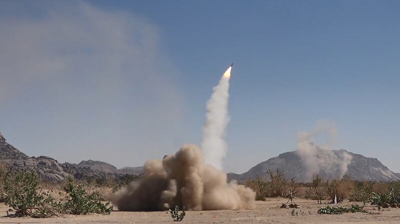 Yemen's Houthi rebels launch a rocket during a military exercise in the northern province of Saada near the border with Saudi Arabia. EPA