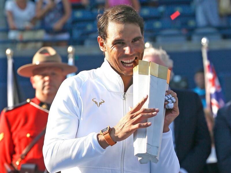 Aug 12, 2018; Toronto, Ontario, Canada; Rafael Nadal (ESP) poses with the Rogers Championship trophy in the Rogers Cup tennis tournament at Aviva Centre. Mandatory Credit: John E. Sokolowski-USA TODAY Sports