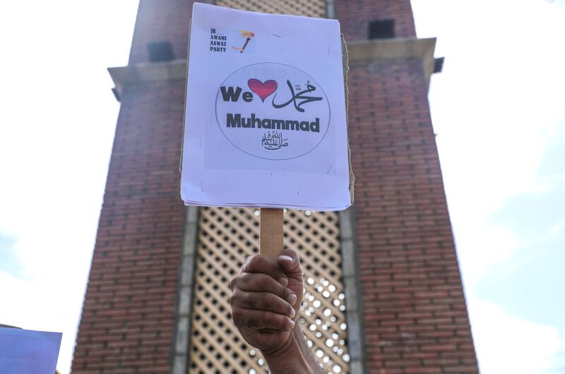 A member of the JK Awami Aawaz Party holds a placard during a protest in Srinagar, the summer capital of Indian Kashmir. EPA