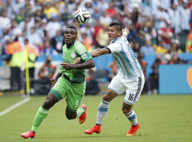 Emmanuel Emenike, left, in action for Nigeria at the 2014 Fifa World Cup. Edgard Garrido / Reuters
