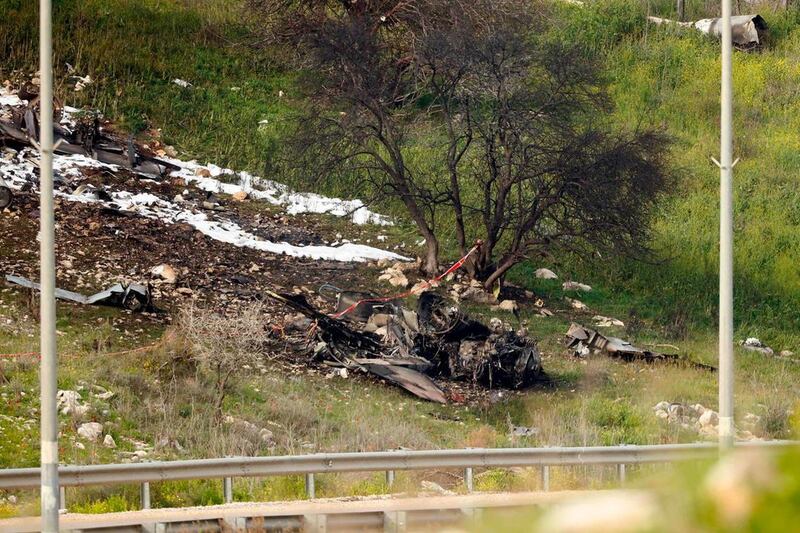 A picture taken in the northern village of Harduf shows the remains of an Israel F-16 that crashed after coming under fire by Syrian air defences during attacks against "Iranian targets" in the war-torn country. Jack Guez / AFP