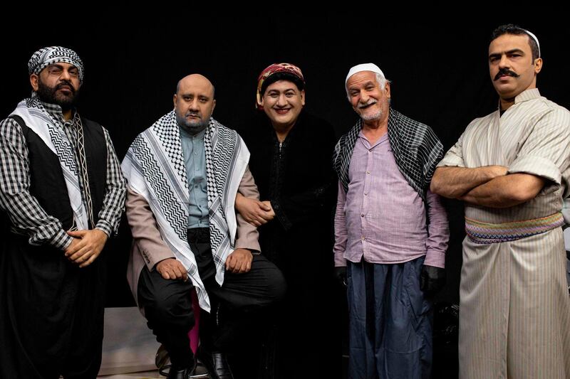 (L to R) Iraqi actors Ayad al-Atabi, Mohammad Qassem, Oussama Mahdi, Kamel al-Azraqi, and Youssef al-Hajjaj pose for a group picture on the set of a parody sketch video of Bab al-Hara, an adaptation of an iconic long-running Syrian television drama, in Iraq's southern port city of Basra on April 22, 2020. AFP / Hussein Faleh