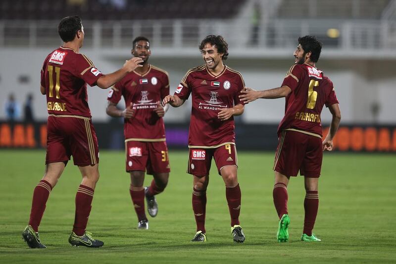 Jorge Valdivia, second right, scored the opening goal for Al Wahda before getting sent off in the second half in the draw against Al Jazira. Mona Al Marzooqi/ The National 