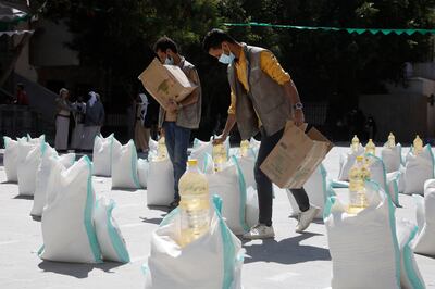 Aid workers prepare food aid provided in Sanaa, Yemen, last October. EPA