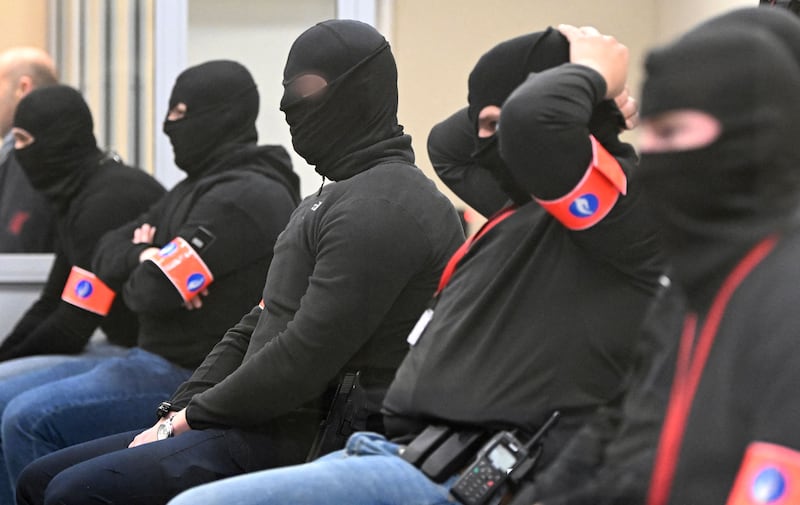 Masked police officers attend a session at the trial of the Brussels terrorist attacks on March 22, 2016.  AFP