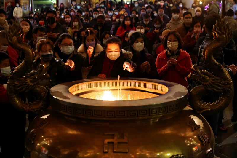 People pray at a temple to celebrate the Lunar New Year in New Taipei City, Taiwan. Reuters