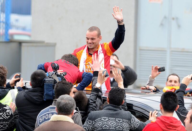 TURKEY OUT
Dutch football player Wesley Sneijder is welcomed by Galatarasay supporters after his arrival at Ataturk airport on January 21, 2013. Dutch midfielder Wesley Sneijder said Monday he was "very happy" to put his protracted departure from Inter Milan behind him as he left Serie A for Turkish giants Galatasaray on Monday. AFP PHOTO / STRINGER = TURKEY OUT
 *** Local Caption ***  309440-01-08.jpg