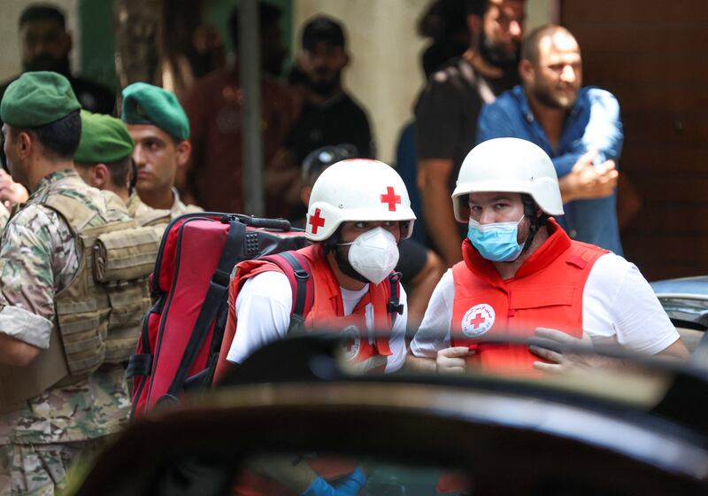 The Lebanese Red Cross on standby outside the bank, which was cordoned off by security forces. Reuters