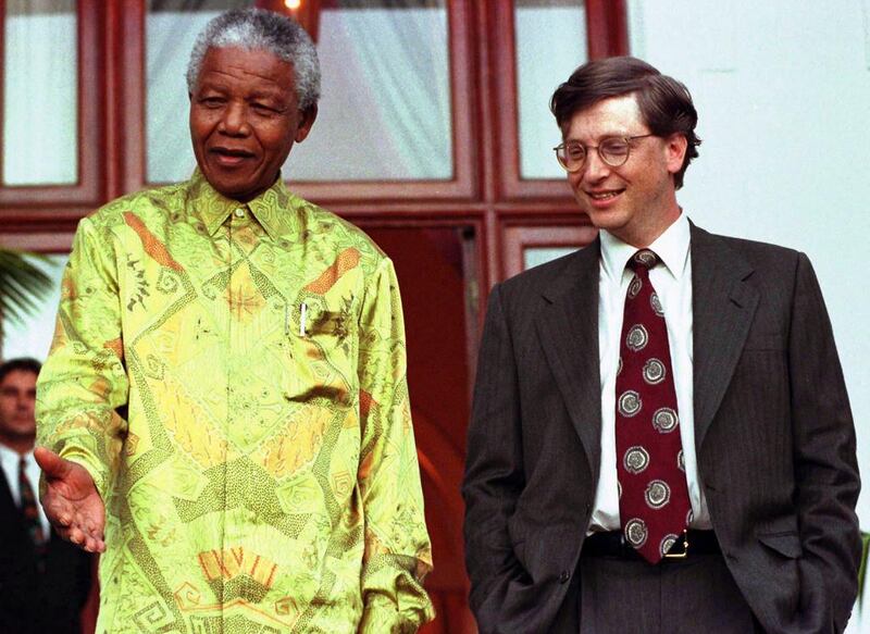 Mandela shares a joke with Microsoft Chairman Bill Gates after their meeting at Mandela’s residence in Cape Town in 1997. Reuters