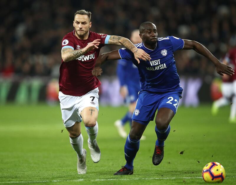 LONDON, ENGLAND - DECEMBER 04:   Marko Arnautovic of West Ham United battles with Sol Bamba of Cardiff City during the Premier League match between West Ham United and Cardiff City at London Stadium on December 04, 2018 in London, United Kingdom. (Photo by Julian Finney/Getty Images)