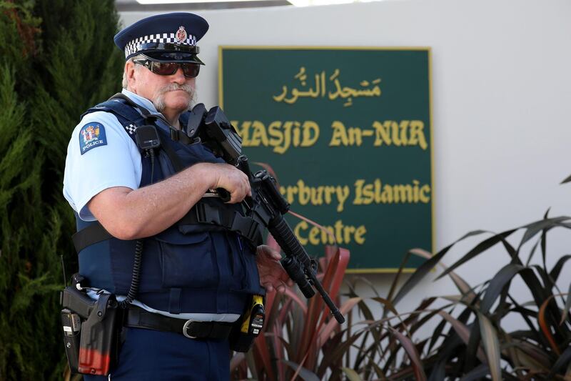 An armed police officer stands guard outside the Al Noor mosque in Christchurch on March 29, 2019.  The remembrance ceremony is being held in memory of the 50 lives that were lost in the March 15th mosque shootings in Christchurch. / AFP / Sanka VIDANAGAMA
