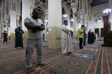 Worshippers wear face masks and maintain safe distance as they attend the Fajr prayer inside the Salah El Din Mosque in Cairo on June 27, 2020. Reuters