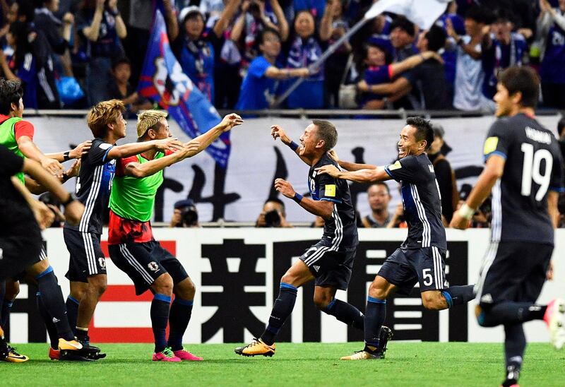 epa06173938 Japan's midfielder Yosuke Ideguchi (C-R) celebrates with his teammates after scoring the 2-0 lead during the FIFA World Cup 2018 qualifying soccer match between Japan and Australia in Saitama, north of Tokyo, Japan, 31 August 2017.  EPA/FRANCK ROBICHON