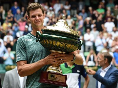 Hubert Hurkacz celebrates with the trophy after beating Daniil Medvedev in Halle Open final. AFP