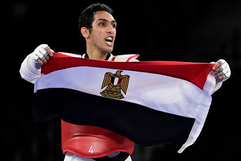 Egypt's Seif Eissa celebrates after winning a bronze medal in taekwondo at the Makuhari Messe Hall in Tokyo.