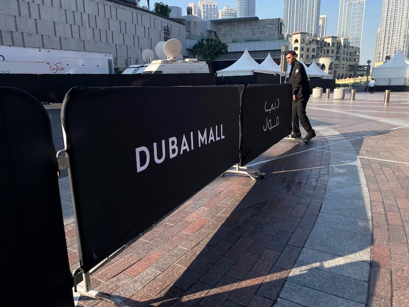 Security staff put crowd barriers in place at Dubai Mall to tell the public here is the place for New Year celebrations
