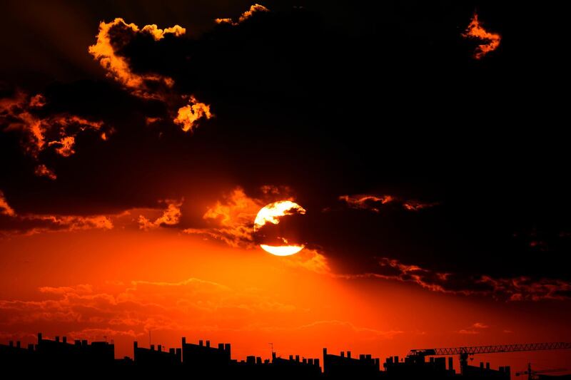 The sun sets over the skyline in Madrid, Spain. Gabriel Bouys/AFP