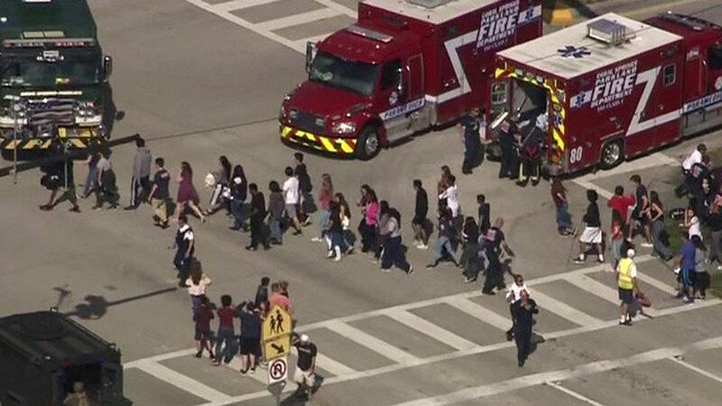Students are evacuated from Marjory Stoneman Douglas High School during a shooting incident in Parkland, Florida, U.S. February 14, 2018 in a still image from video. WSVN.com via REUTERS. ATTENTION EDITORS - THIS IMAGES HAS BEEN PROVIDED BY A THIRD PARTY. NO RESALES, NO ARCHIVES. MANDATORY CREDIT. NO ACCESS SOUTHEAST FLORIDA MEDIA.