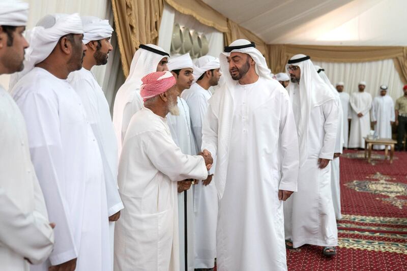 FUJAIRAH, UNITED ARAB EMIRATES - September 16, 2019: HH Sheikh Mohamed bin Zayed Al Nahyan, Crown Prince of Abu Dhabi and Deputy Supreme Commander of the UAE Armed Forces (C) offers condolences to the family of martyr Warrant Officer Saif Dhawi Rashid Al Tunaiji.

( Mohamed Al Hammadi / Ministry of Presidential Affairs )
---