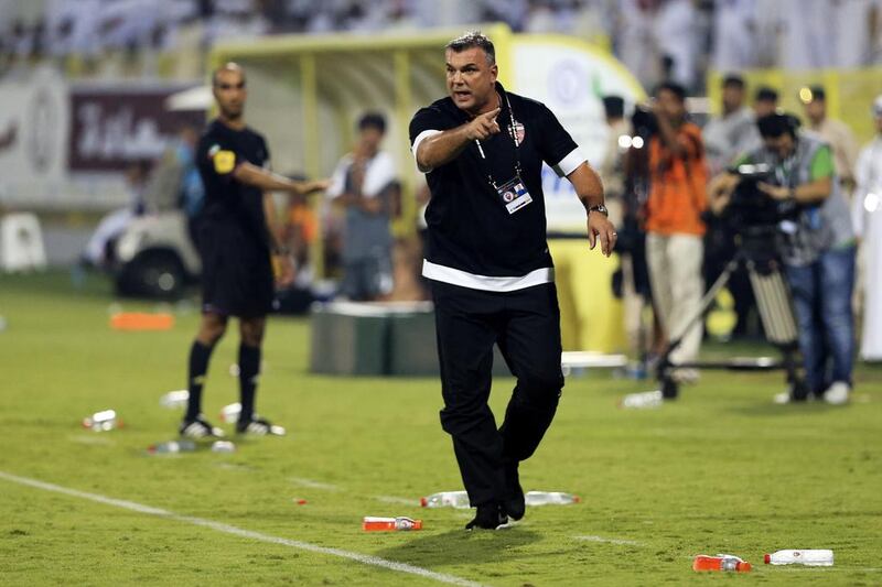 Cosmin Olaroiu has seen his Al Ahli side win their opening two Arabian Gulf League fixtures, while title rivals Al Ain have already tasted defeat in their first fixture of the 2013/14 season. Sarah Dea / The National