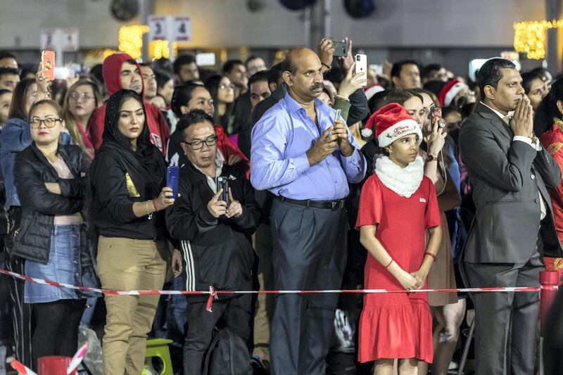 DUBAI, UNITED ARAB EMIRATES. 25 DECEMBER 2019. Midnight Mass at St Mary’s in Dubai to celebrate Christmas. Members of the public and family members wait orderly for the ceremony to start. (Photo: Antonie Robertson/The National) Journalist: None. Section: National.
