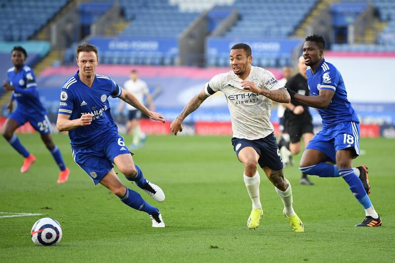 Gabriel Jesus of Manchester City and Jonny Evans of Leicester City chase the ball. Getty Images