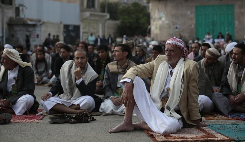 Yemeni Muslims offer prayers to celebrate Edi al-Adha, or Feast of Sacrifice, that commemorates the Prophet Ibrahim's faith, in Sanaa, Yemen.  Hani Mohammed / AP Photo