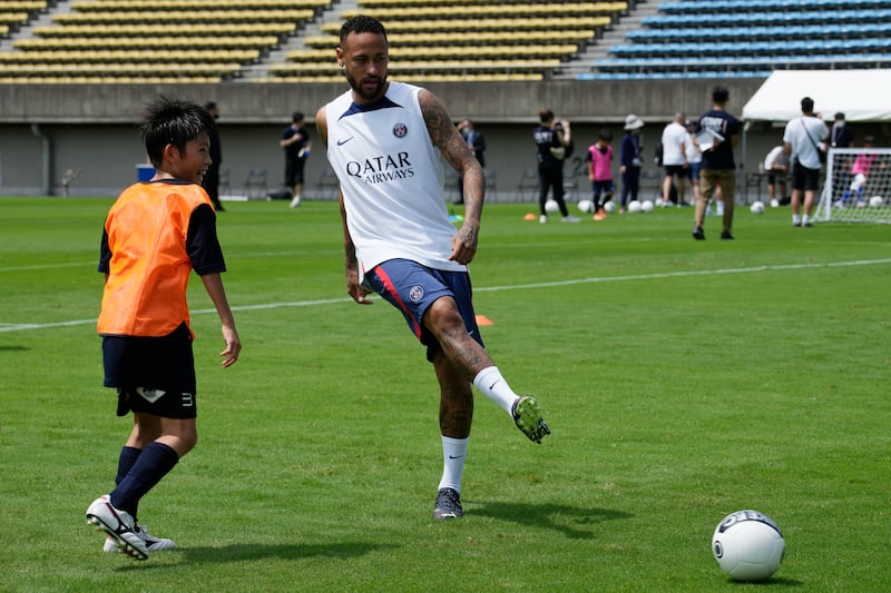 Paris Saint-Germain's Neymar kicks a ball. AP Photo
