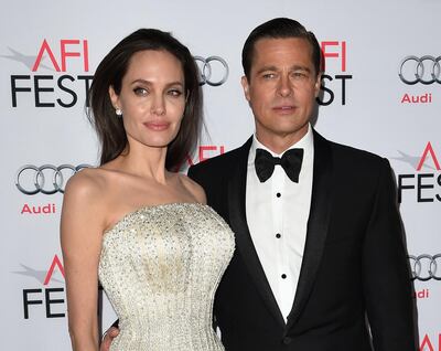 (FILES) In this file photo taken on November 5, 2015 Writer-director-producer-actress Angelina Jolie Pitt (L) and actor-producer Brad Pitt arrive for the opening night gala premiere of Universal Pictures' 'By the Sea' during AFI FEST 2015 presented by Audi at the TCL Chinese Theatre in Hollywood. A California judge ruled that a custody order concerning Brad Pitt and Angelina Jolie's children must be modified in his favor, according to court documents filed by the "Fight Club" actor's lawyers.
Hollywood superstars Pitt and Jolie, who have six children and were once Hollywood's highest profile couple, formally divorced two years ago but have remained locked in a private court battle since.
 / AFP / MARK RALSTON
