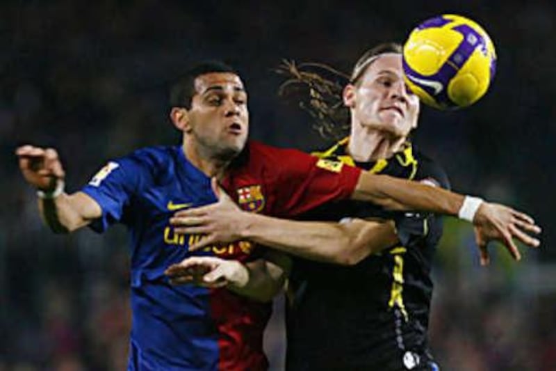 Barcelona's Daniel Alves, left, proved ineffective against Getafe.
