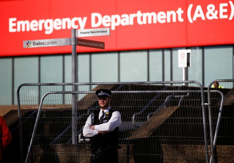 A police officer stands outside St Thomas' Hospital after British Prime Minister Boris Johnson was moved to intensive care while his coronavirus (COVID-19) symptoms worsened and has asked Secretary of State for Foreign affairs Dominic Raab to deputise, London, Britain, April 7, 2020. REUTERS/Henry Nicholls