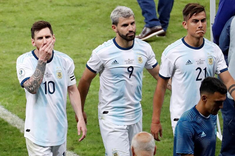 Argentina players Lionel Messi, left, Sergio Aguero and Paolo Dybala leave the pitch dejected. AFP