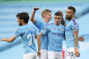 Soccer Football - Premier League - Manchester City v Burnley - Etihad Stadium, Manchester, Britain - June 22, 2020 Manchester City's Phil Foden celebrates scoring their first goal with Oleksandr Zinchenko, David Silva and Nicolas Otamendi, as play resumes behind closed doors following the outbreak of the coronavirus disease (COVID-19) Martin Rickett/Pool via REUTERS EDITORIAL USE ONLY. No use with unauthorized audio, video, data, fixture lists, club/league logos or "live" services. Online in-match use limited to 75 images, no video emulation. No use in betting, games or single club/league/player publications. Please contact your account representative for further details.