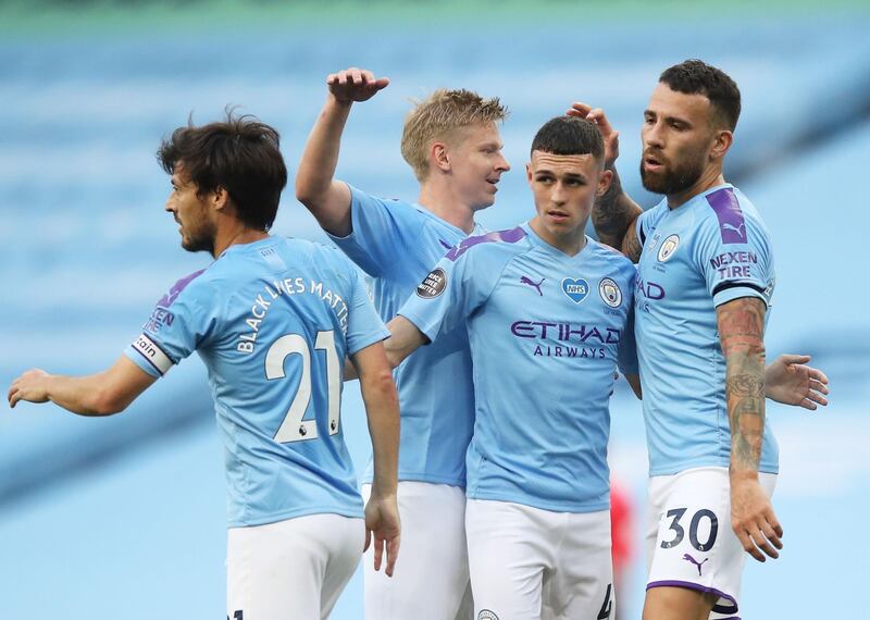 Soccer Football - Premier League - Manchester City v Burnley - Etihad Stadium, Manchester, Britain - June 22, 2020 Manchester City's Phil Foden celebrates scoring their first goal with Oleksandr Zinchenko, David Silva and Nicolas Otamendi, as play resumes behind closed doors following the outbreak of the coronavirus disease (COVID-19) Martin Rickett/Pool via REUTERS  EDITORIAL USE ONLY. No use with unauthorized audio, video, data, fixture lists, club/league logos or "live" services. Online in-match use limited to 75 images, no video emulation. No use in betting, games or single club/league/player publications.  Please contact your account representative for further details.