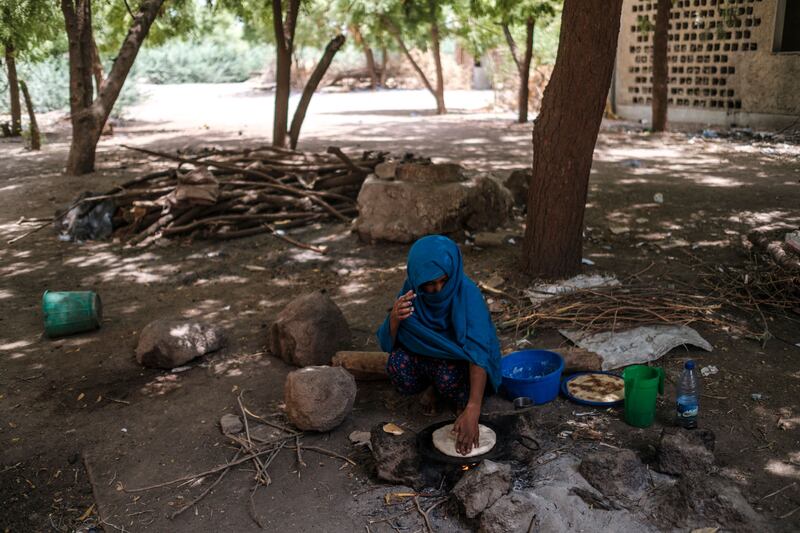 The burden of collecting fuel and making meals typically falls on women, preventing many from pursuing an education. AFP