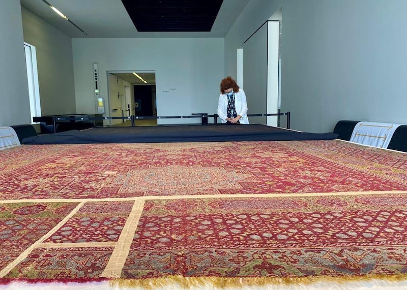 Until June 24, Louvre Abu Dhabi’s visitors will be able to see the restoration of the 'three-medallion carpet' live. Courtesy DCT Abu Dhabi