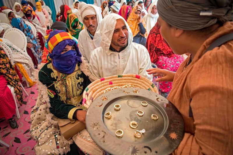 Young Amazigh (Berber) men and women wait to exchange rings during the annual Engagement Moussem festival in Morocco. Photo: Fadel Senna / AFP