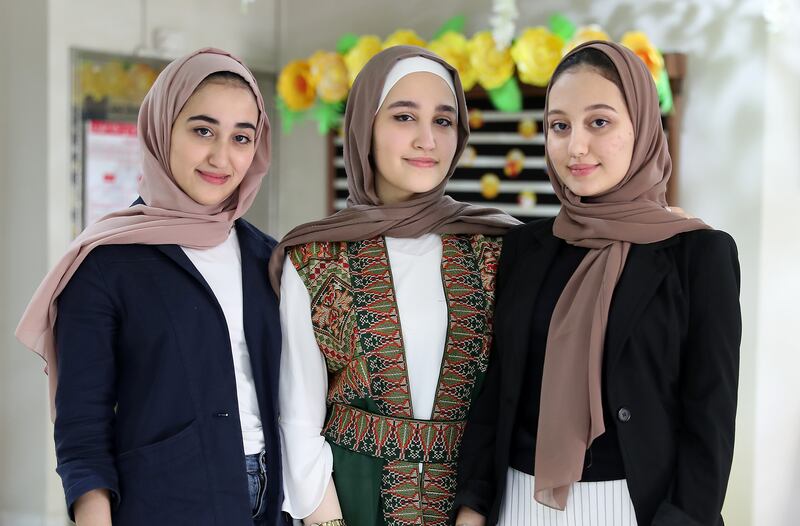 Lujain Thouqan, Farah Thouqan and Leen Thouqan, triplet sisters who scored the same top mark in high-school final exams at the Al-Hikmah Private School in Ajman.