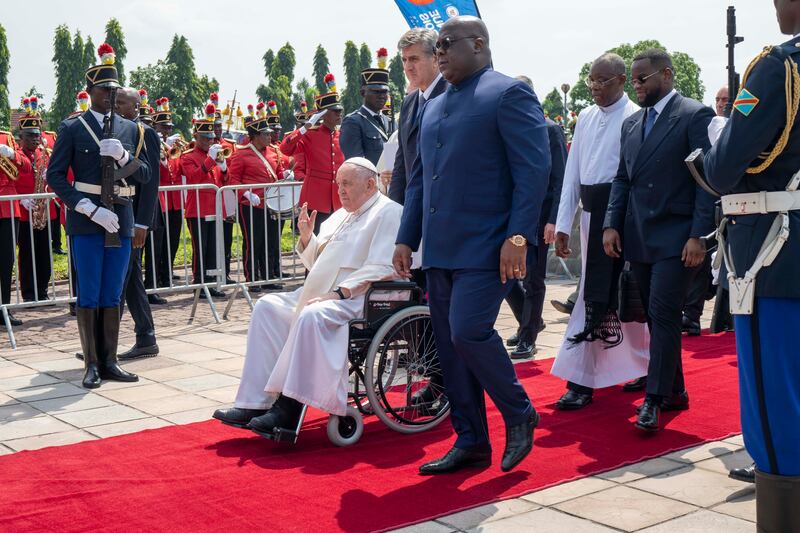 Pope Francis waves as he departs for South Sudan from Kinshasa.  AP Photo