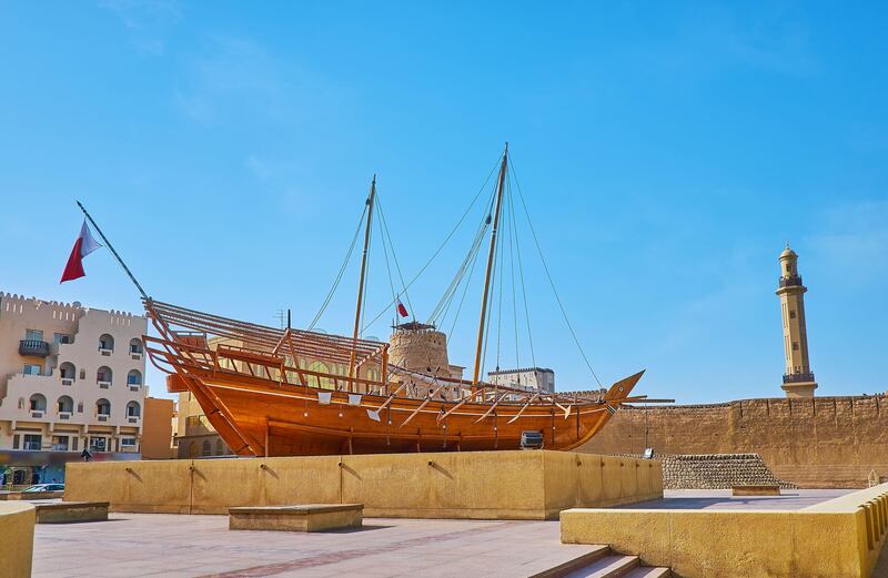 The area in front of the historic Al Fahidi Fort in Dubai is decorated with an installation of a traditional dhow. Alamy