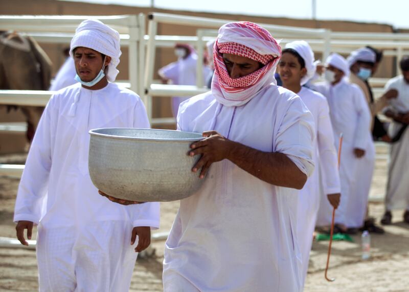 The milk is brought to the judges' tent.