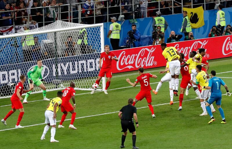 Colombia's Yerry Mina heads in the equalising goal in the 93rd minute of the match - sending it into extra time. Antonio Calanni / AP Photo