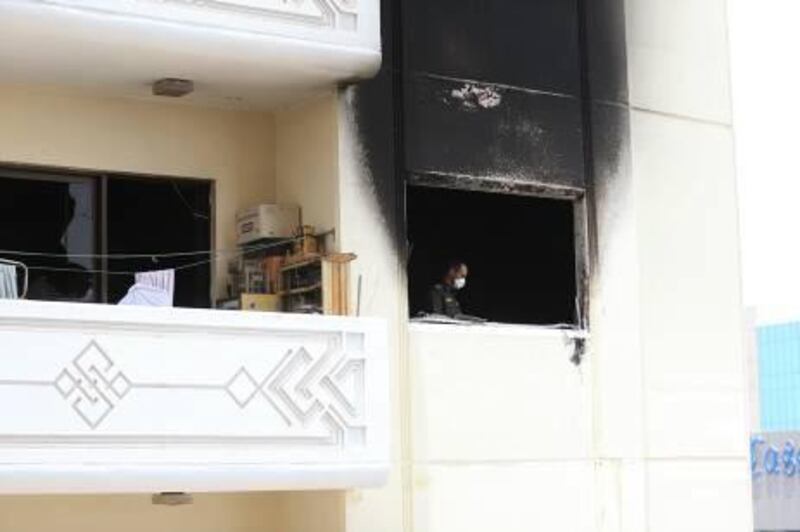 Abu Dhabi, June 4, 2013 - Officials investigate the 15th floor unit that was burned a day after a fire tore through Al Sadaf tower on Electra street  in Abu Dhabi, June 4, 2013. (Photo by: Sarah Dea/The National)


