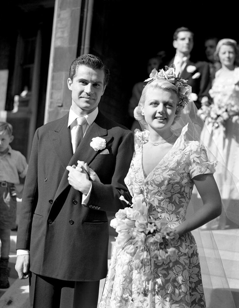 Lansbury with her husband Peter Shaw after their wedding at St Columba's Church, London. They were married for 54 years. PA