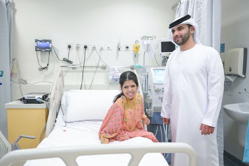 Sheikh Mansoor bin Mohammed, vice chairman of the Dubai Health board of directors, meets a young patient at Al Jalila Children’s Hospital. Photo: Dubai Media Office