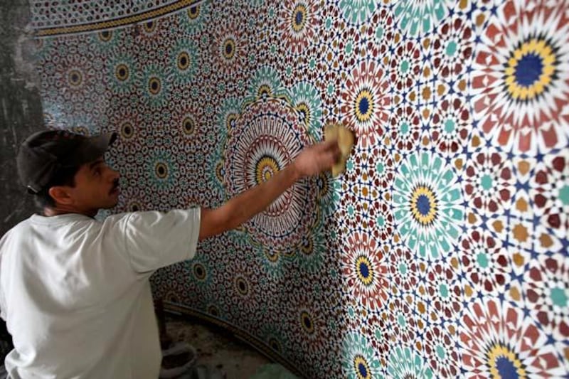 DUBAI, UNITED ARAB EMIRATES Ð May 24, 2011: Qasim Thaesh working on the mosaic in the Mehrab area at the under construction Al Farooq mosque in Al Safa area in Dubai. (Pawan Singh / The National) For News. Story by James