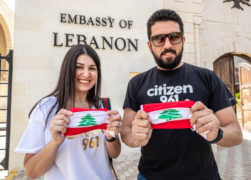 Nadine Abou Ghali and Rabah Sakr after casting their votes at the Embassy of Lebanon in Abu Dhabi. Victor Besa / The National