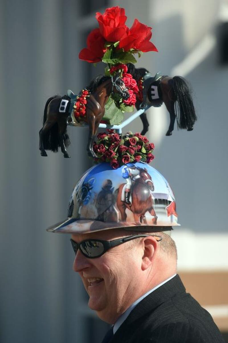 Skip Koepnick of Wyoming, Michigan looks on wearing a festive hat before the 140th running of the Kentucky Derby at Churchill Downs on May 3, 2014 in Louisville, Kentucky. Dylan Buell / Getty Images / AFP